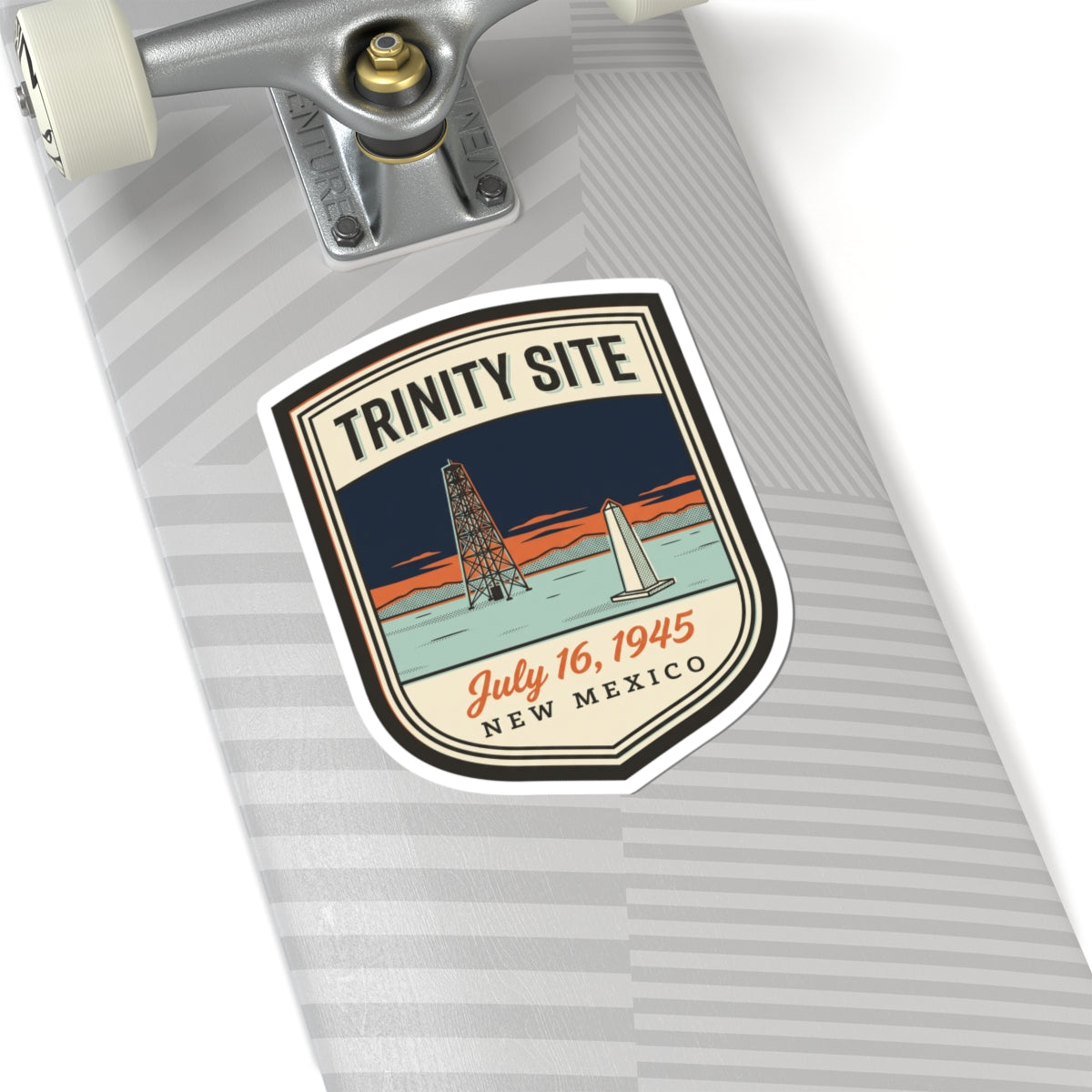 Trinity Site sticker badge on notebook page, oil rig and “July 16, 1945 New Mexico”