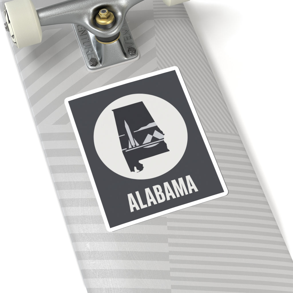 Alabama outline vinyl decal sticker with white circle emblem and “ALABAMA” text on light striped surface