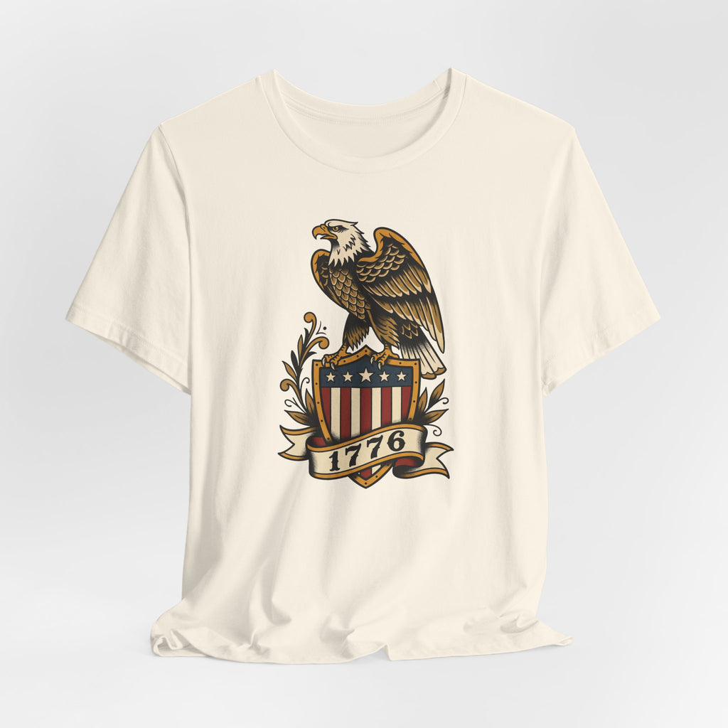Cream crewneck T-shirt featuring bald eagle shield graphic with stars and 1776 banner