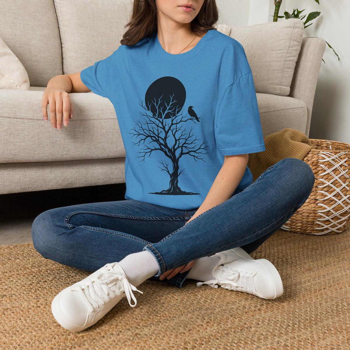 Blue t-shirt with black moonlit tree silhouette and crow graphic on the front