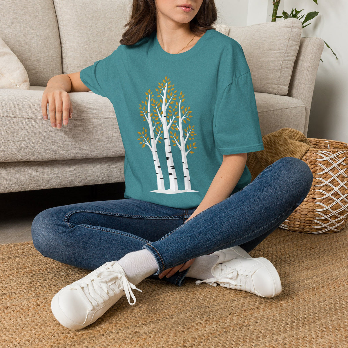 Teal unisex graphic T-shirt with birch tree forest illustration on the chest