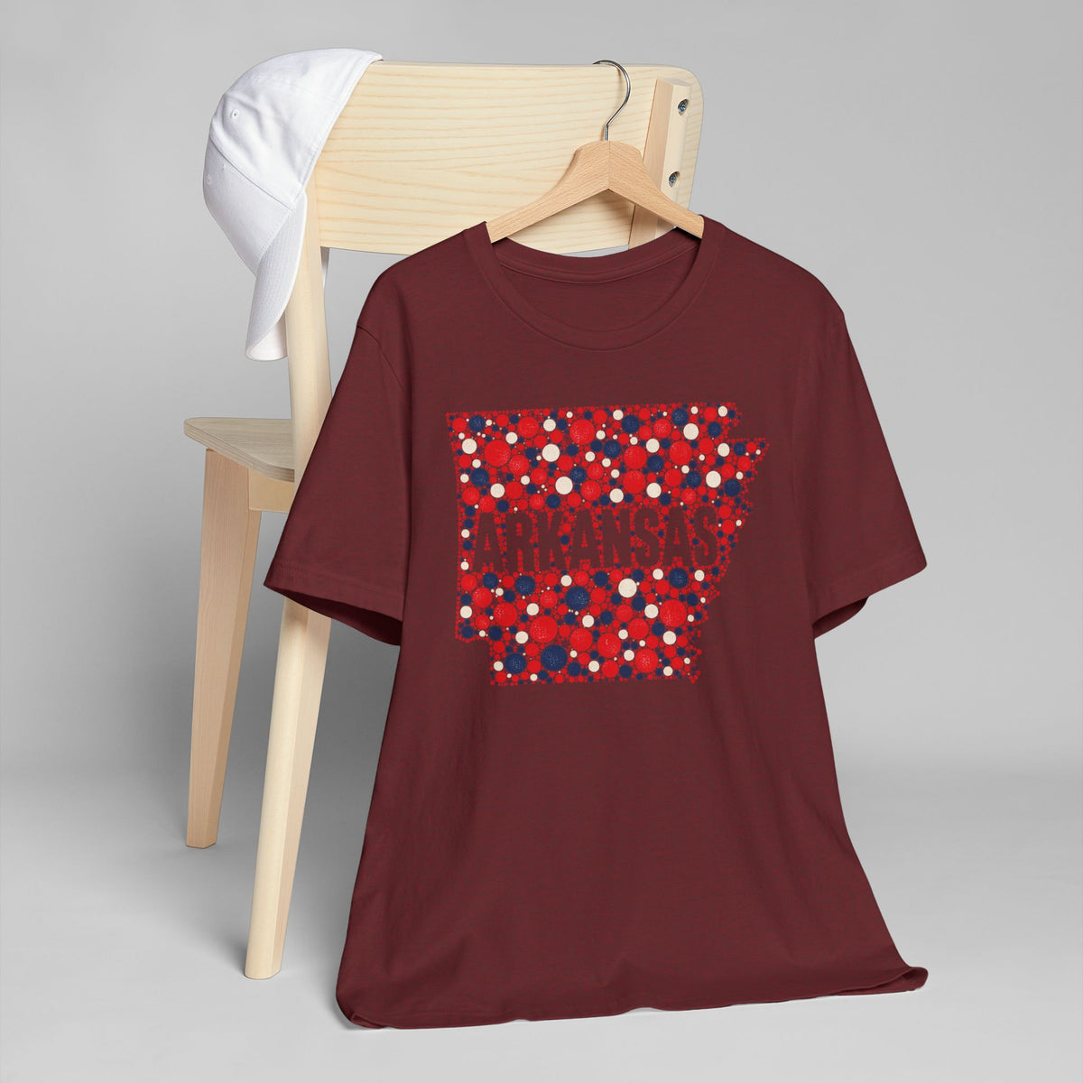 Burgundy crew-neck t-shirt with red and blue dotted Arkansas graphic