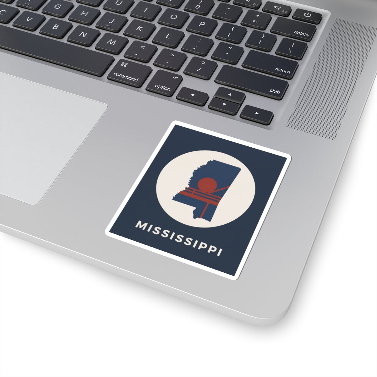 Square sticker with Mississippi outline in white circle, retro red sun, and MISSISSIPPI text