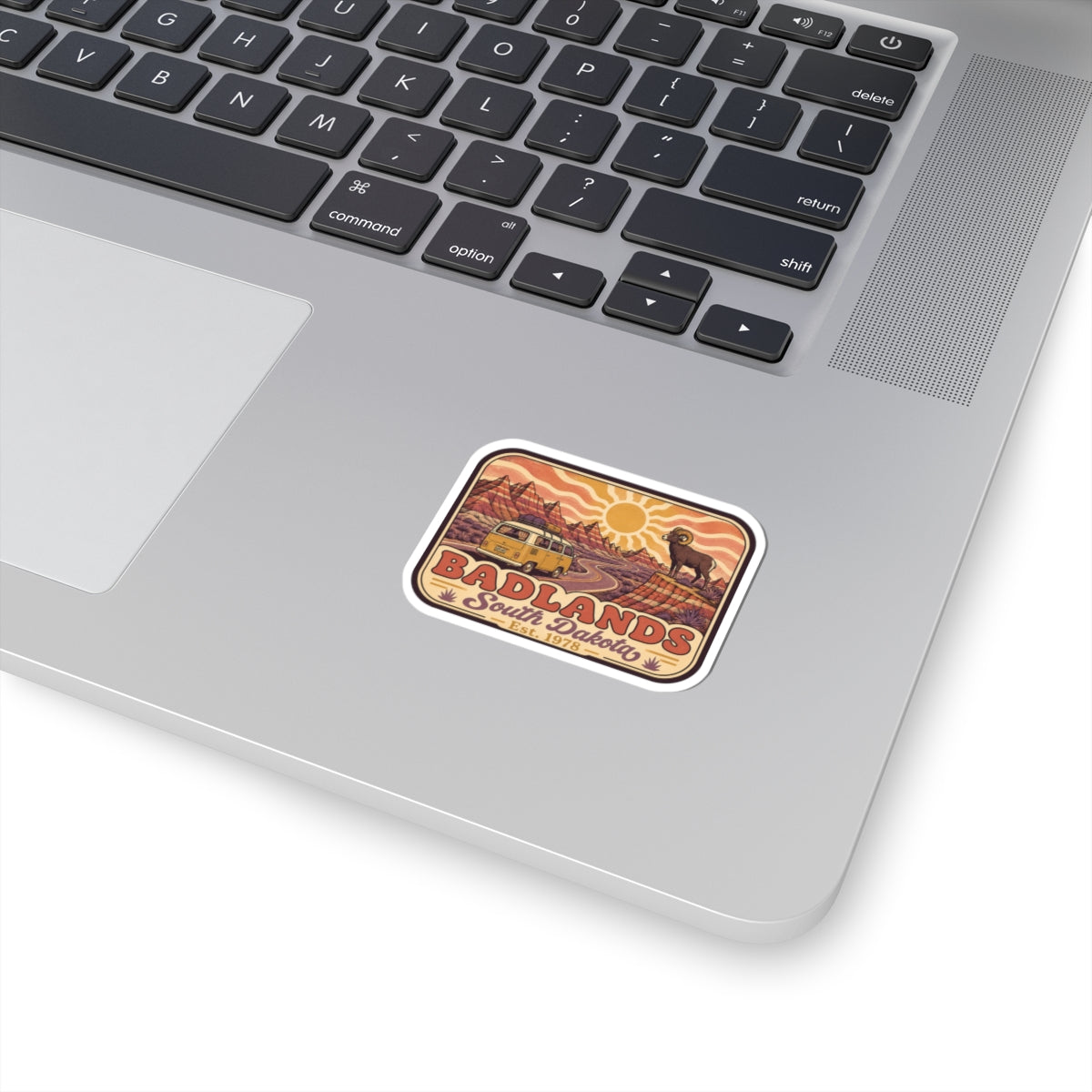Badlands South Dakota retro sticker with orange sunset and bighorn sheep icon, kiss-cut