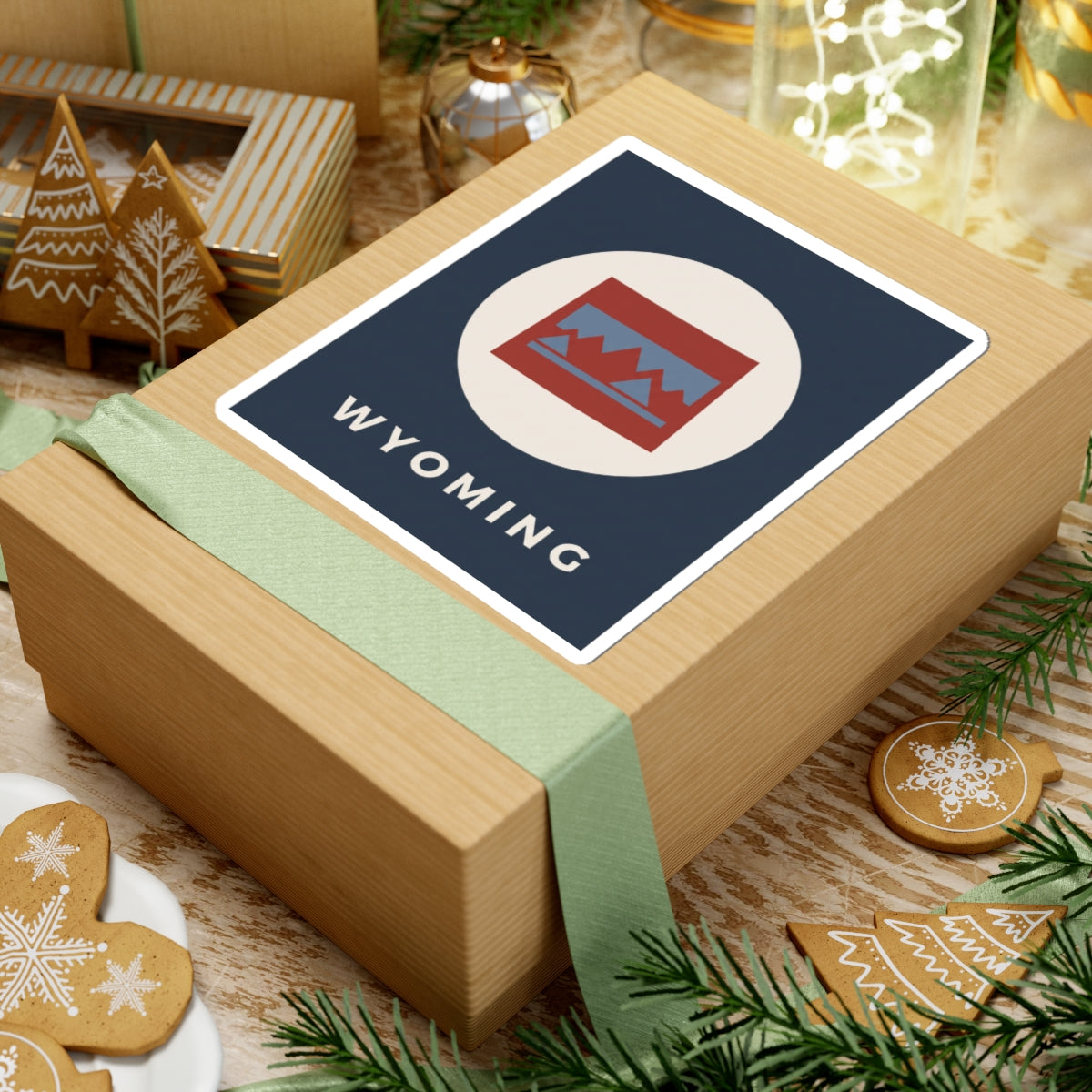 Square Wyoming badge sticker with navy background, red/blue mountain icon, and “WYOMING”.