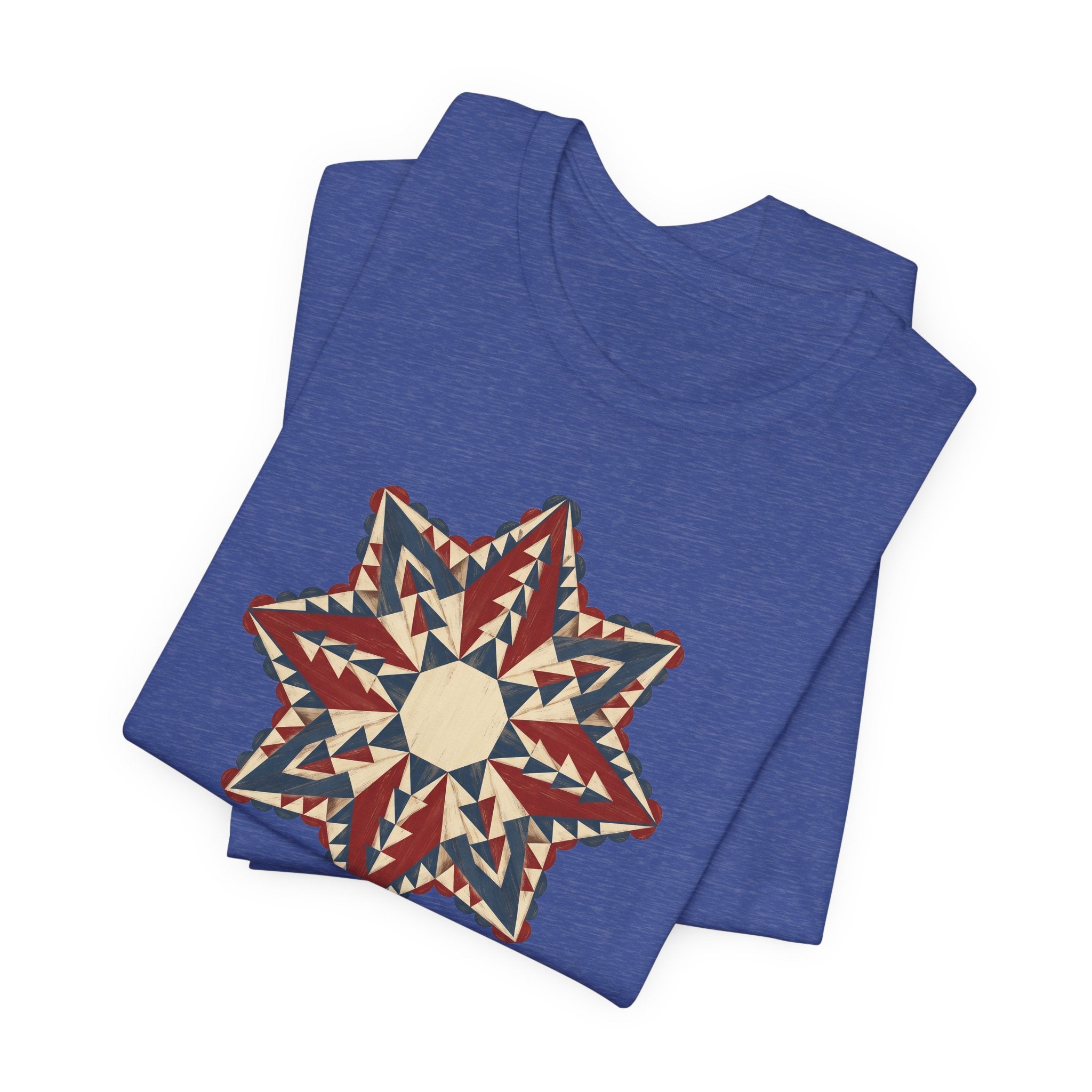 Blue graphic T-shirt with large star mandala print in red, cream, and tan triangles