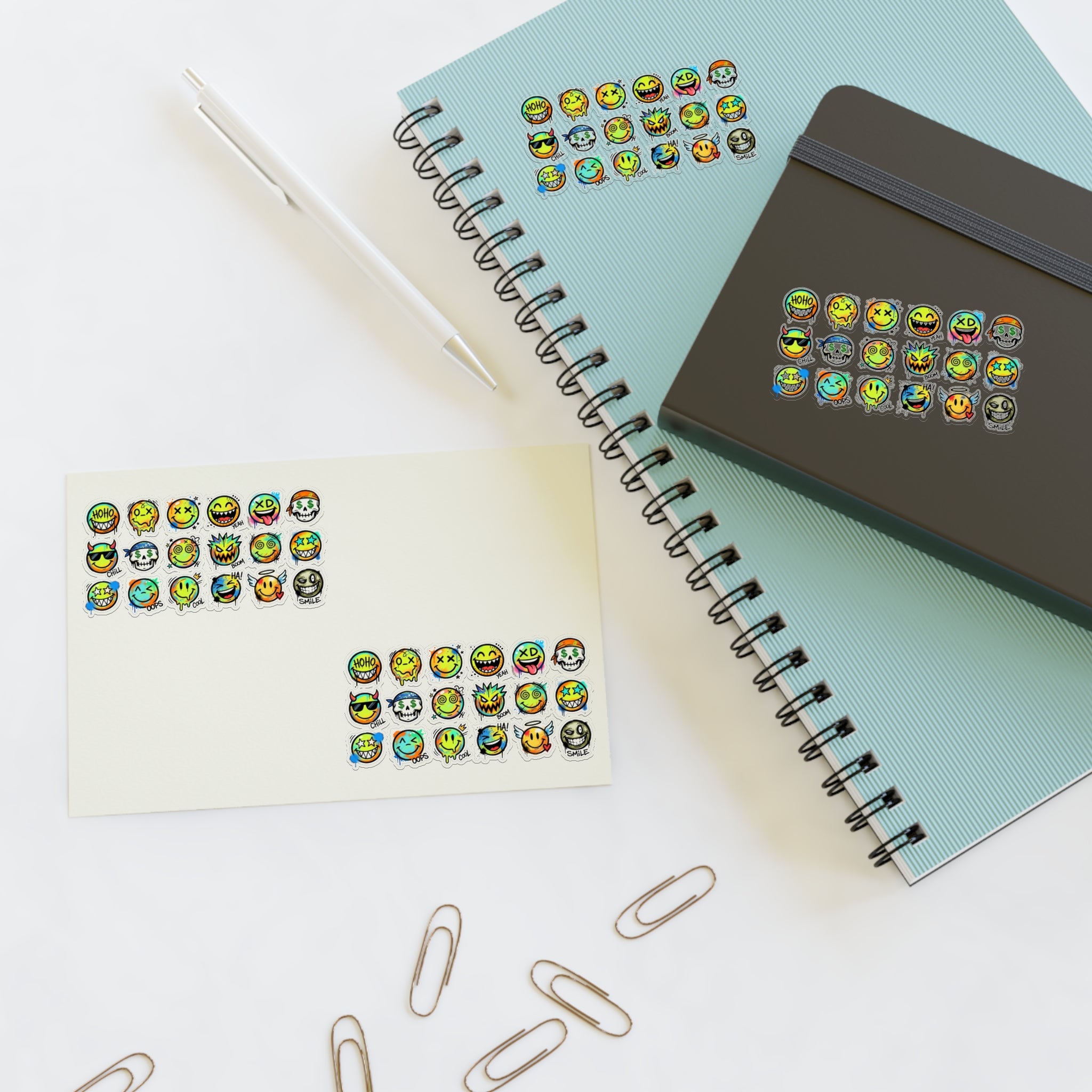 Emoji face sticker sheet with die-cut icons, colorful expressions shown on a white sheet