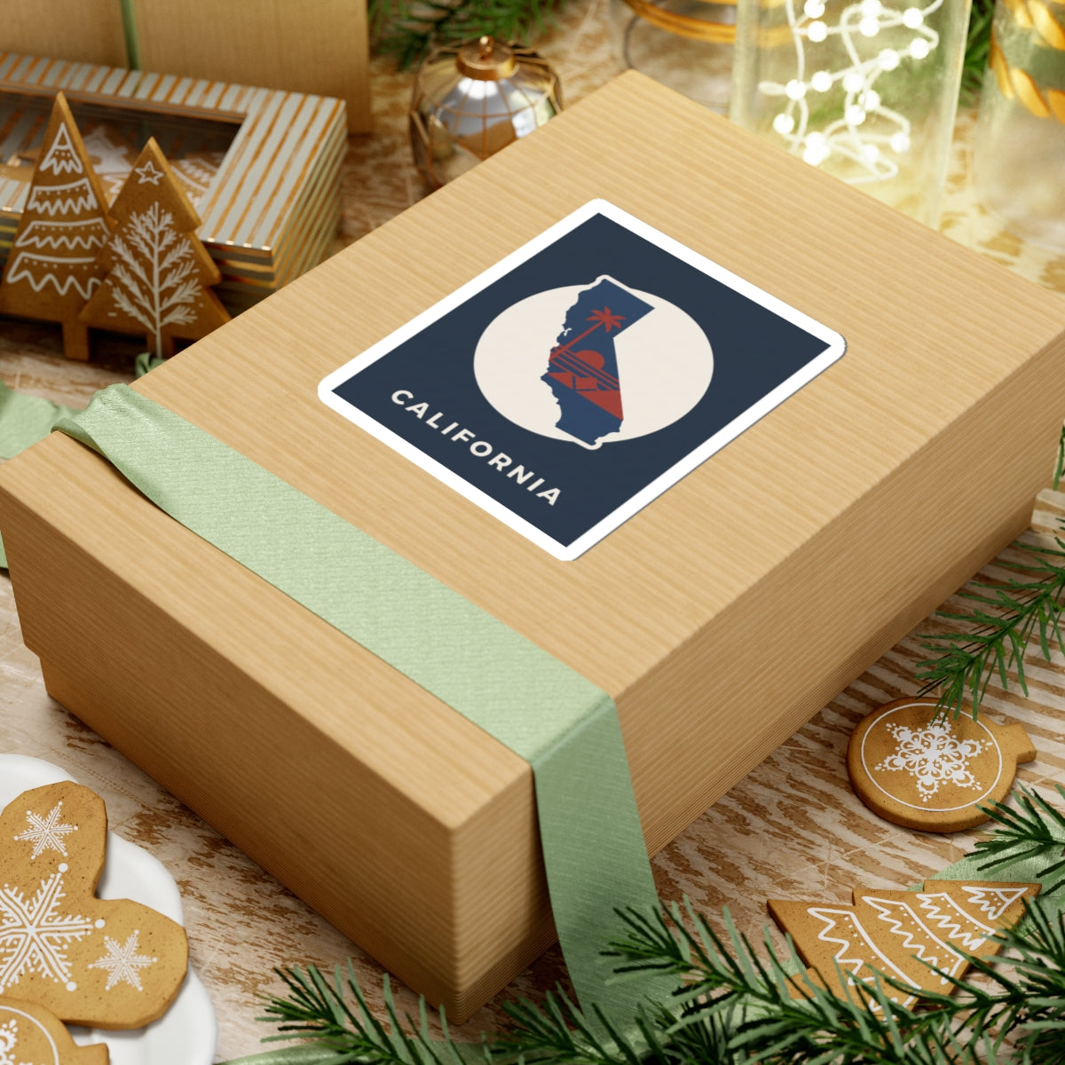 California silhouette sticker on gift box: navy square with white circle and "CALIFORNIA"
