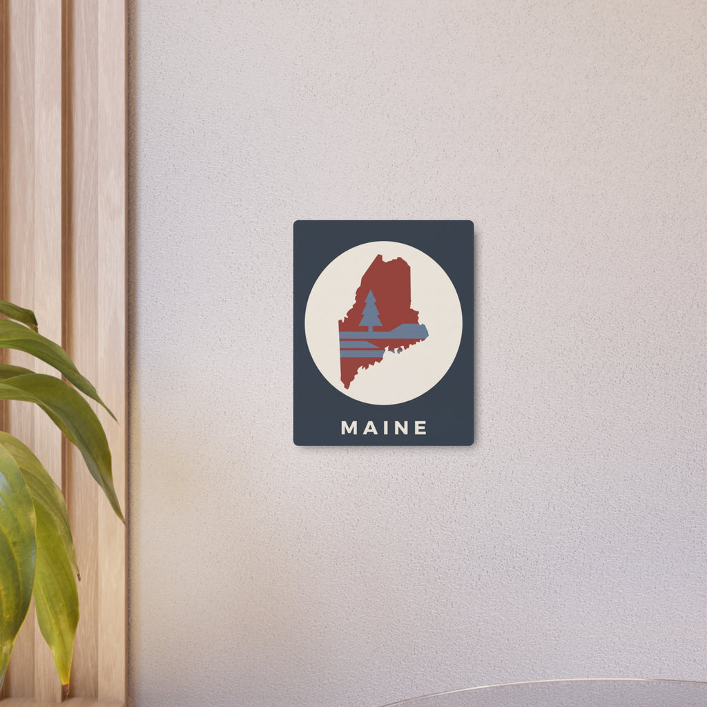 Small wall art metal sign: dark blue square with circular pine tree Maine silhouette and “MAINE”