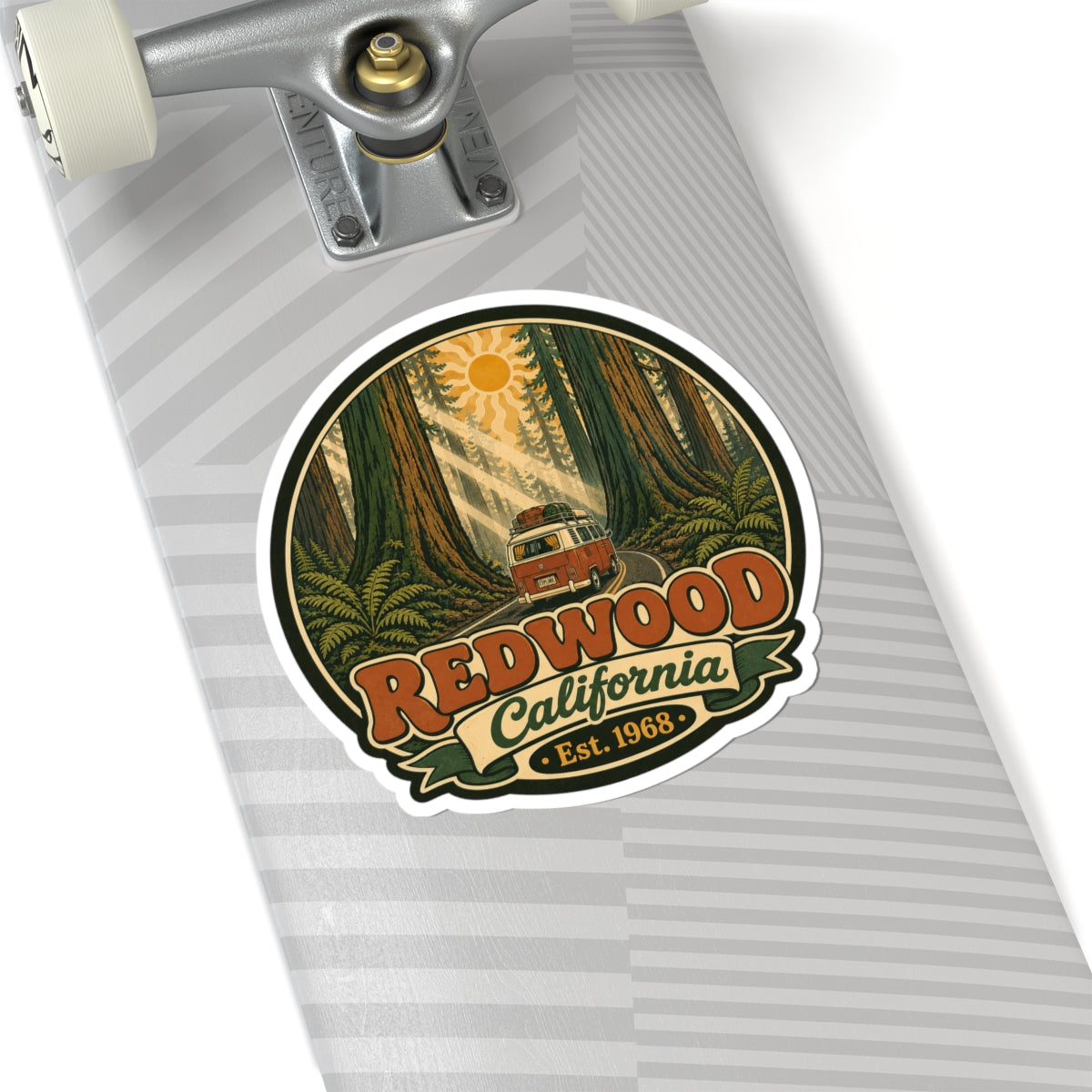 Round sticker with redwood forest, camper van, sun, and “Redwood California” with “Est. 1968.”
