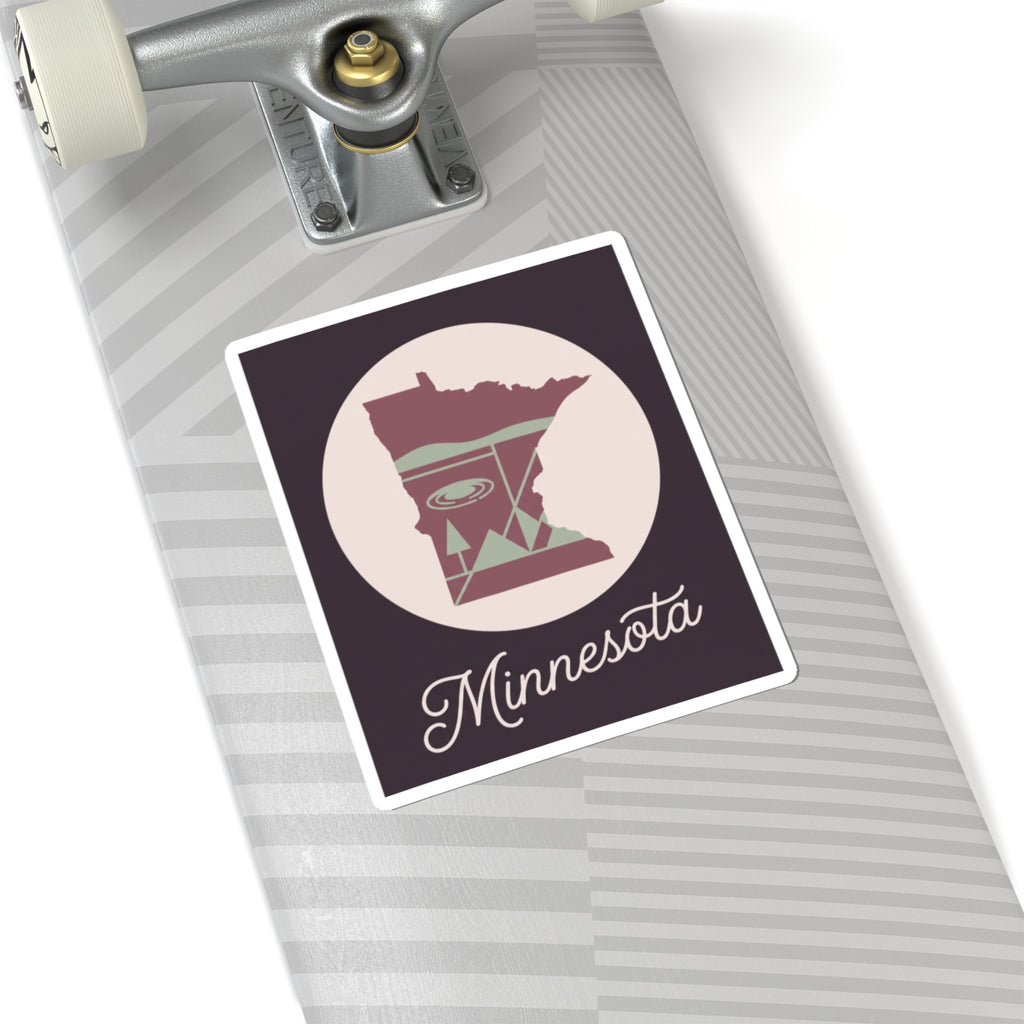 Minnesota decal on skateboard deck, state silhouette circle with “Minnesota” script