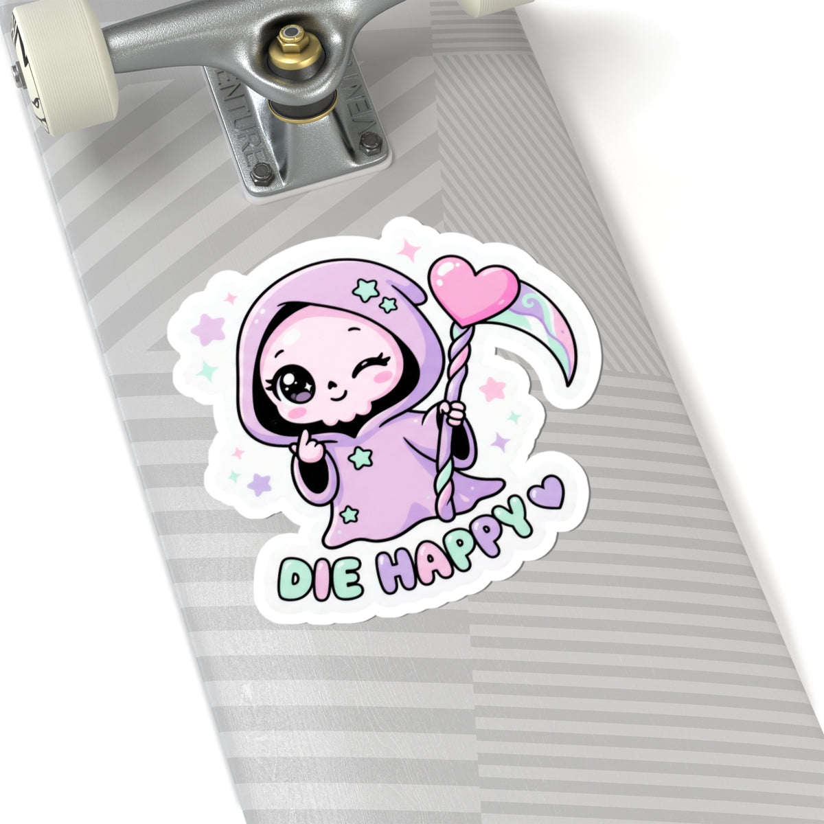 Cute grim reaper kiss-cut sticker on a striped backing, holding pink heart; “Die Happy”