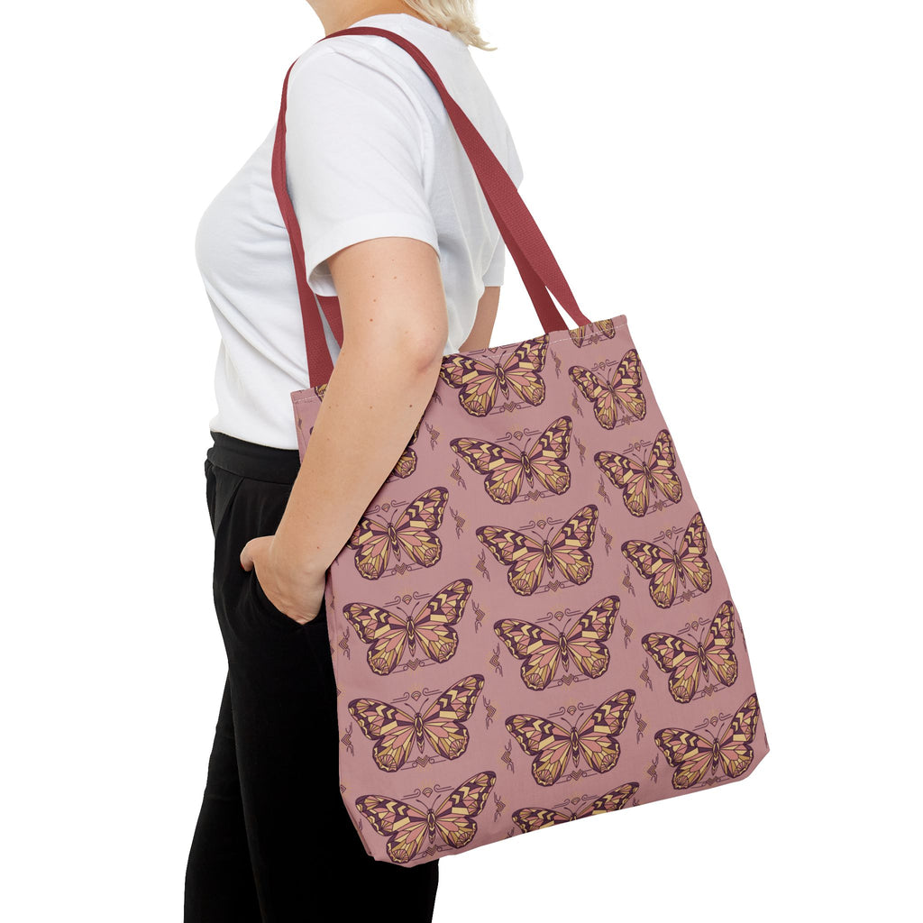 Butterfly-print tote bag in pink with brown-red straps, side view