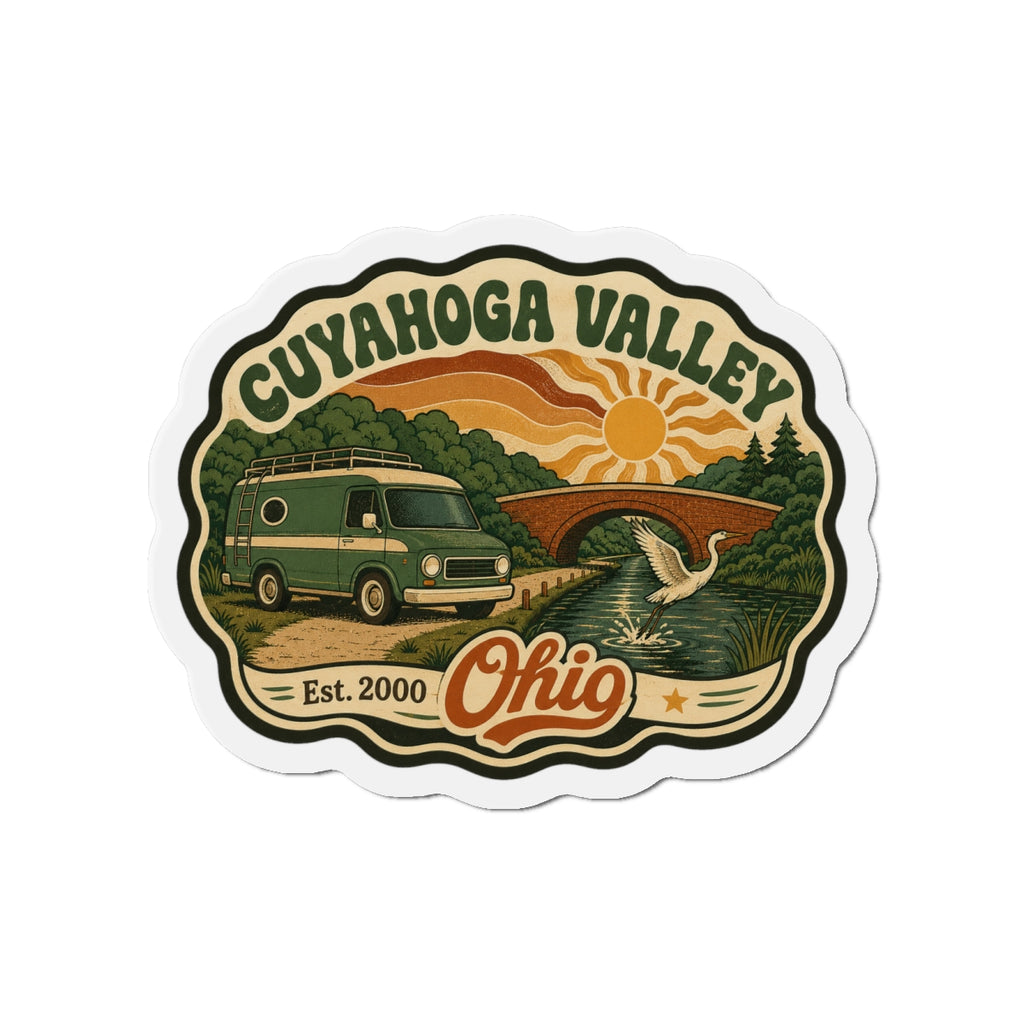 Die-cut fridge magnet showing Cuyahoga Valley landscape with camper van, river and sun.