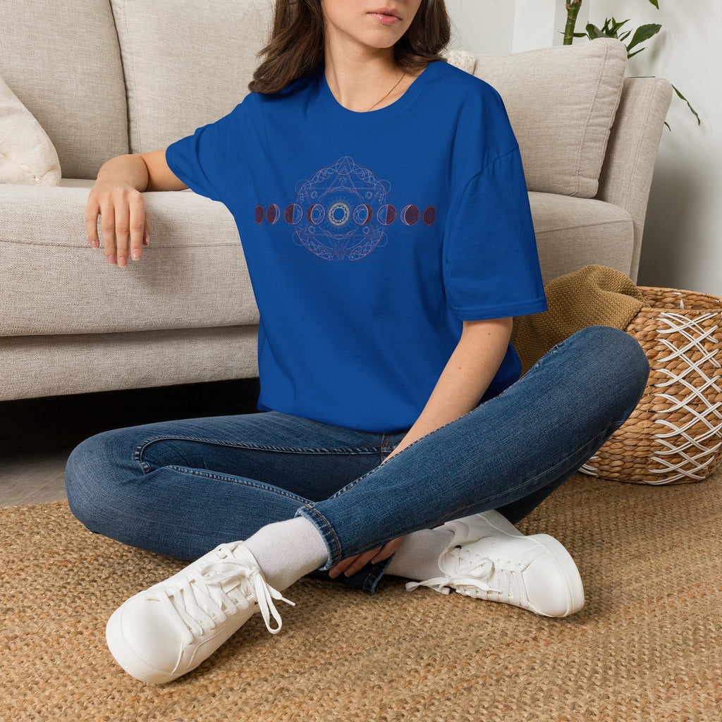 Bright blue T-shirt with dark moon-phase circular geometric graphic on chest