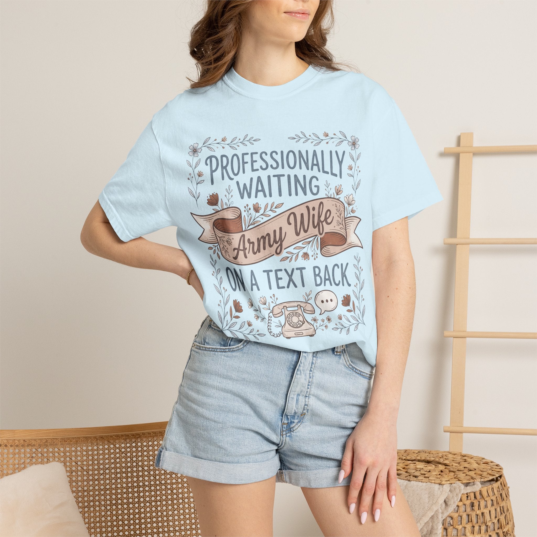 Light blue crew-neck T-shirt on model with front “Professionally Waiting” graphic