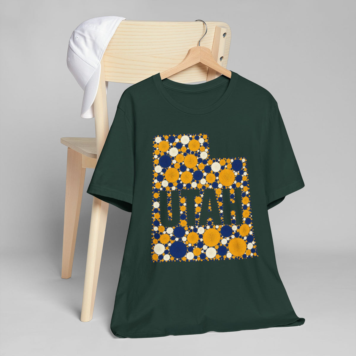 Dark green crew-neck T-shirt with multicolor polka dot UTAH graphic