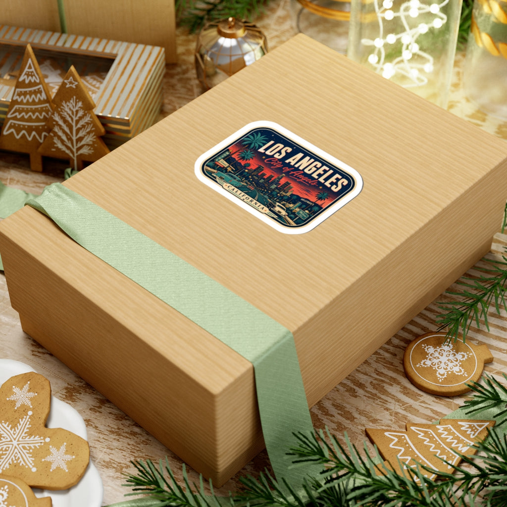 Luggage tag sticker on gift box showing Los Angeles skyline, palm trees, and “City of Angels”
