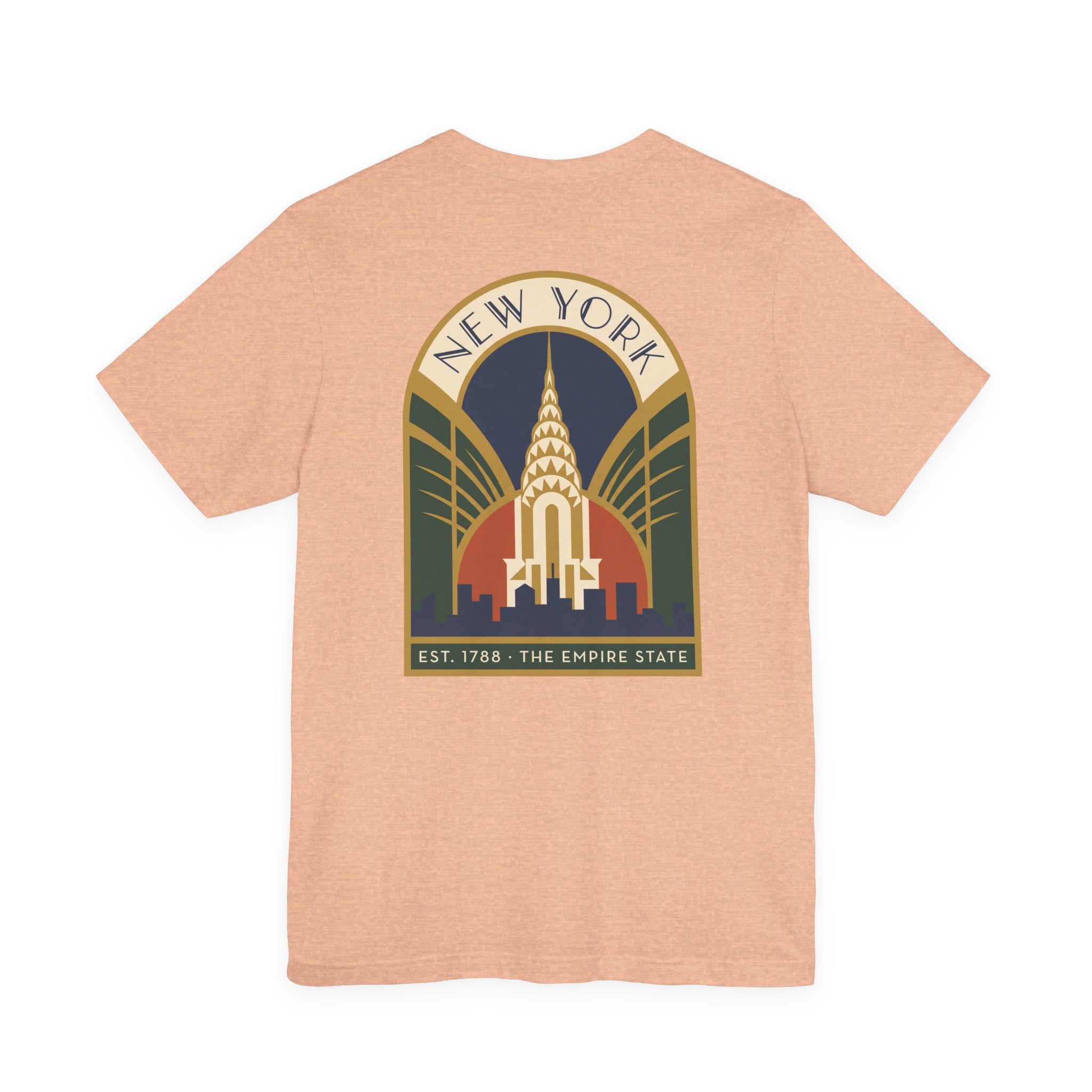Peach T-shirt with large round New York skyline emblem graphic