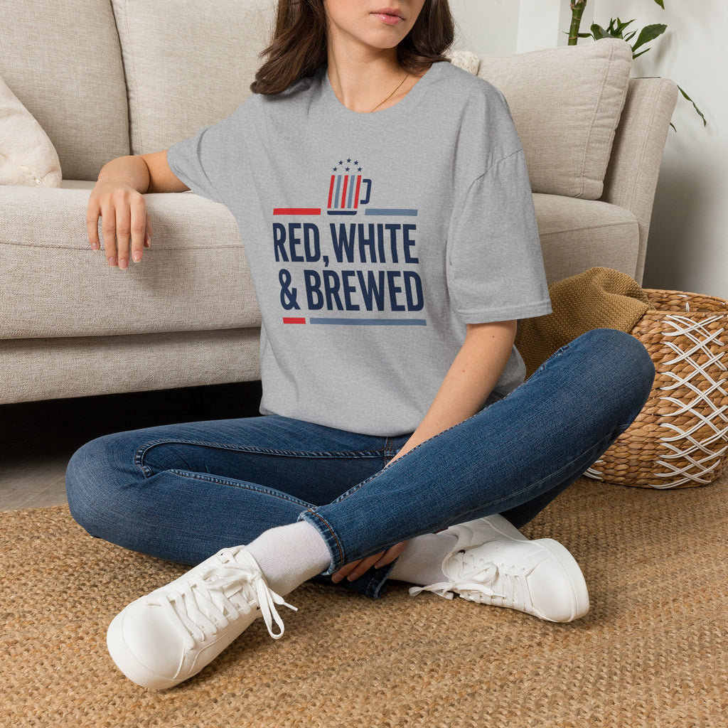 Gray unisex T-shirt with RED, WHITE & BREWED graphic, worn with blue jeans