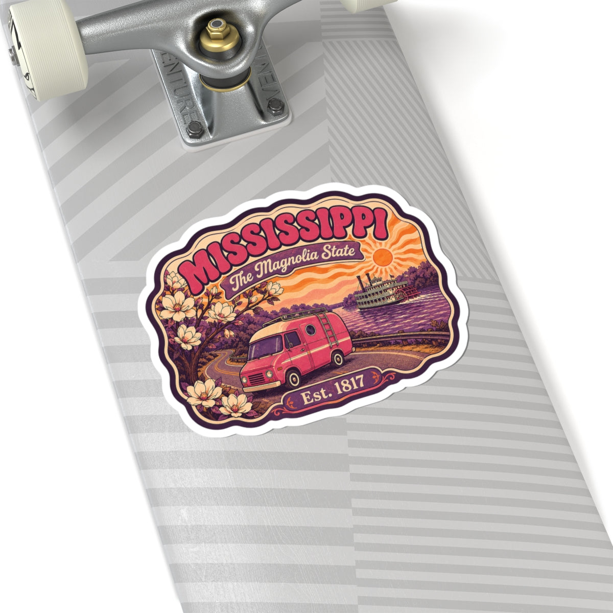 Mississippi state sticker on gray-striped surface; white die-cut border with pink retro camper