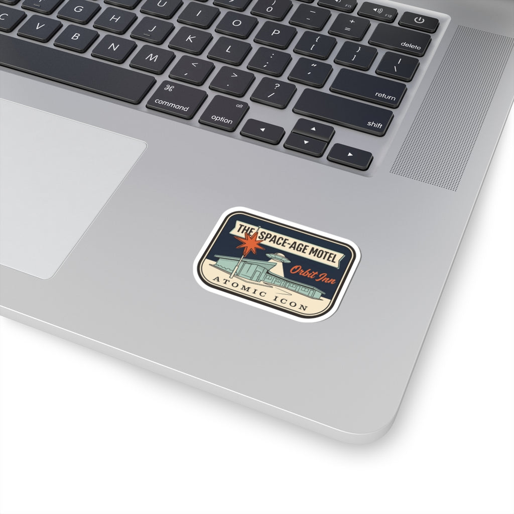 Retro atomic icon logo kiss-cut sticker on laptop trackpad