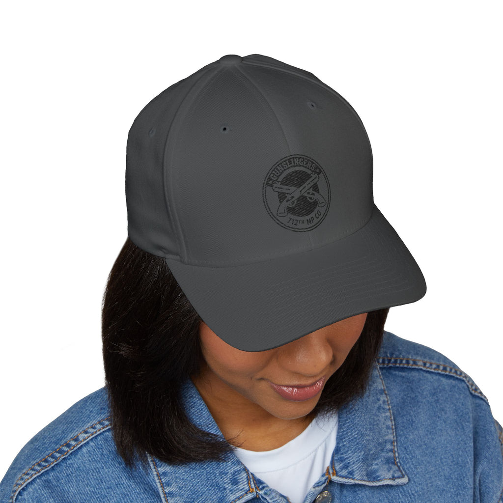 Dark grey embroidered baseball cap with circular emblem patch on front