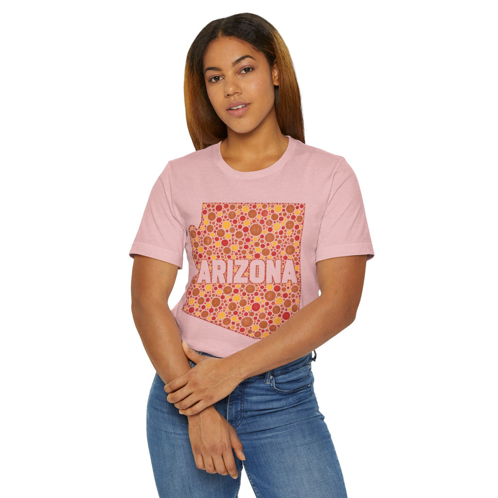 Blush pink short-sleeve t-shirt on model with orange patterned Arizona outline graphic