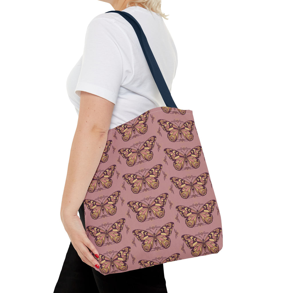 Butterfly print tote bag with dark handle straps, side view on a person