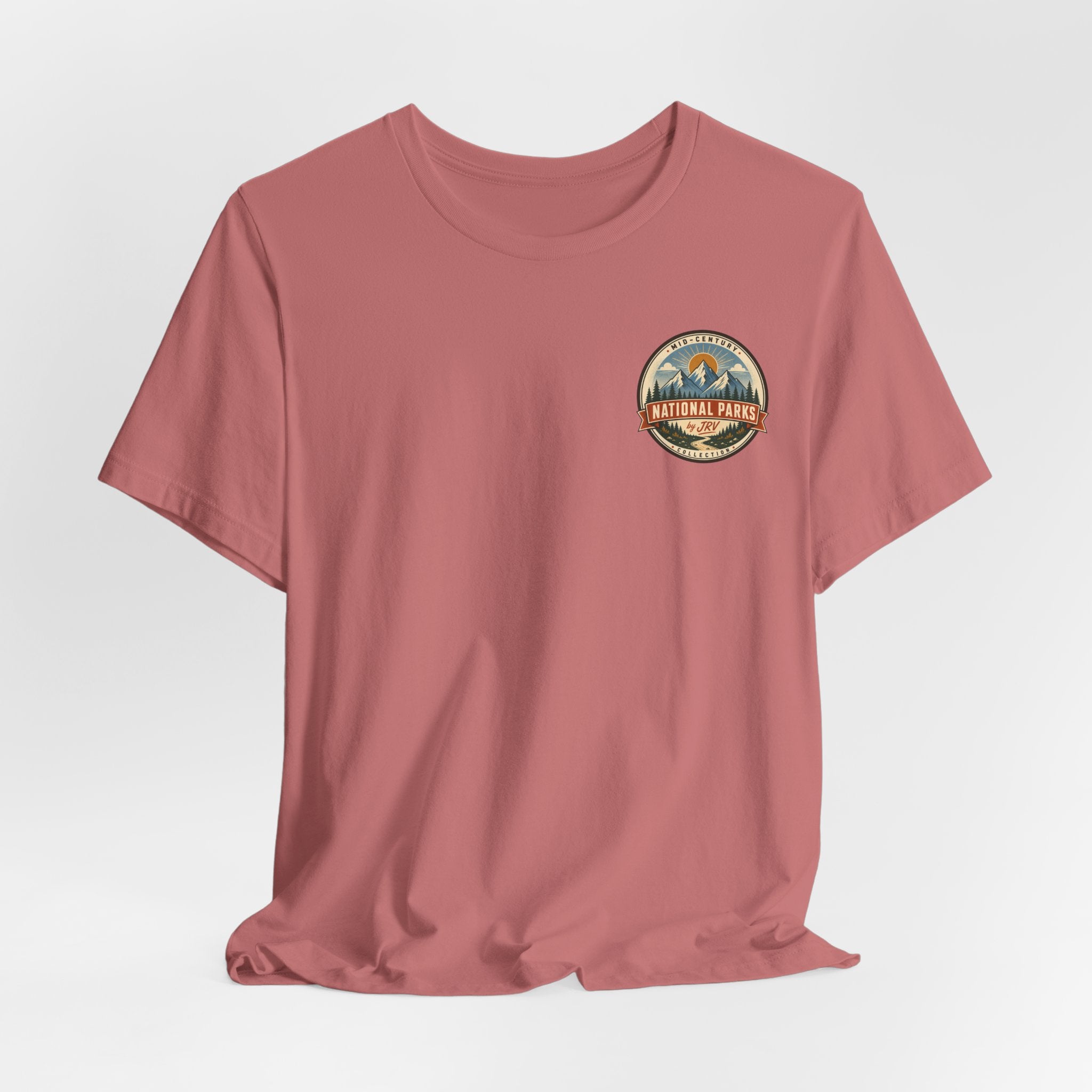 Rose crew-neck T-shirt with small circular National Park graphic on the upper chest.
