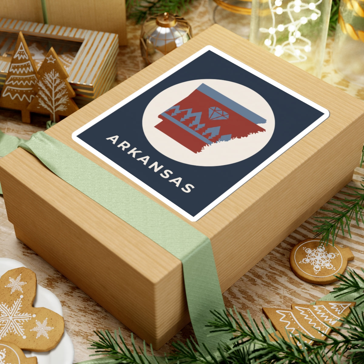 Arkansas emblem sticker on wrapped gift, diamond and pine tree graphic with ARKANSAS