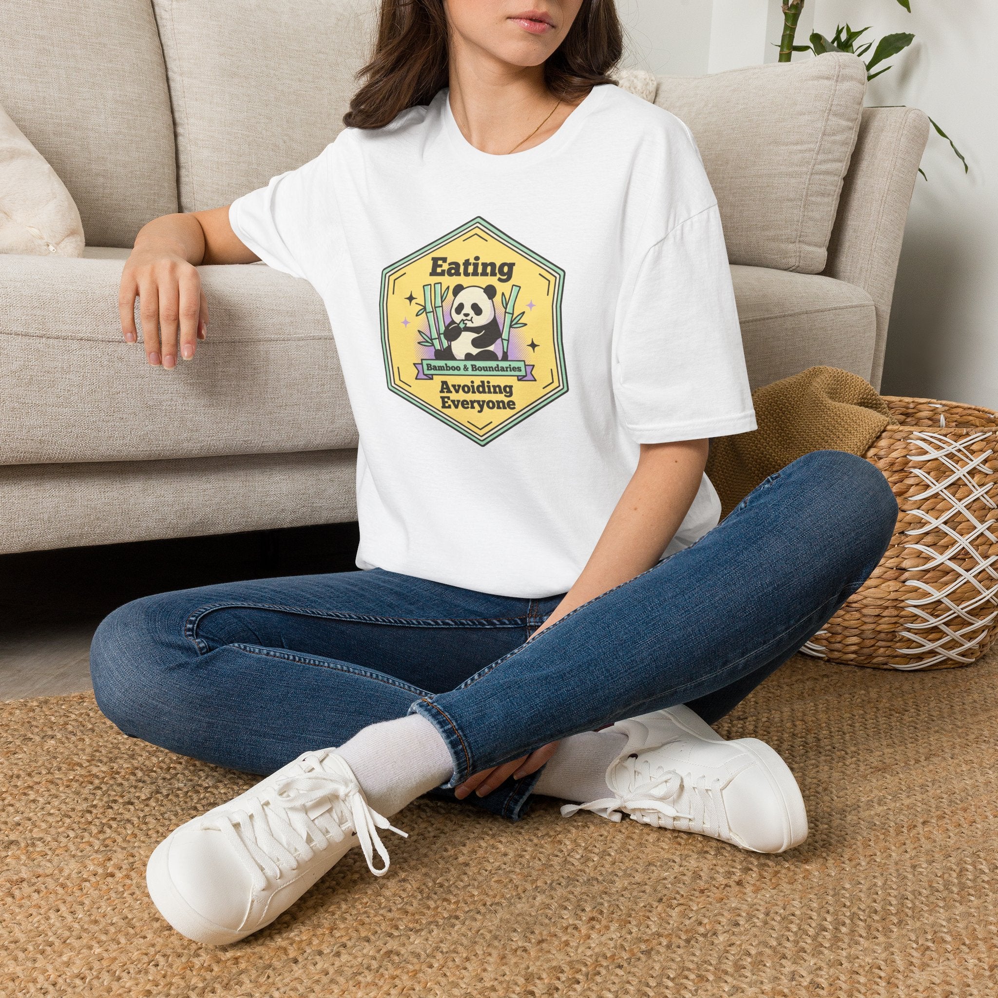 Unisex softstyle T-shirt in white worn by model with front graphic print
