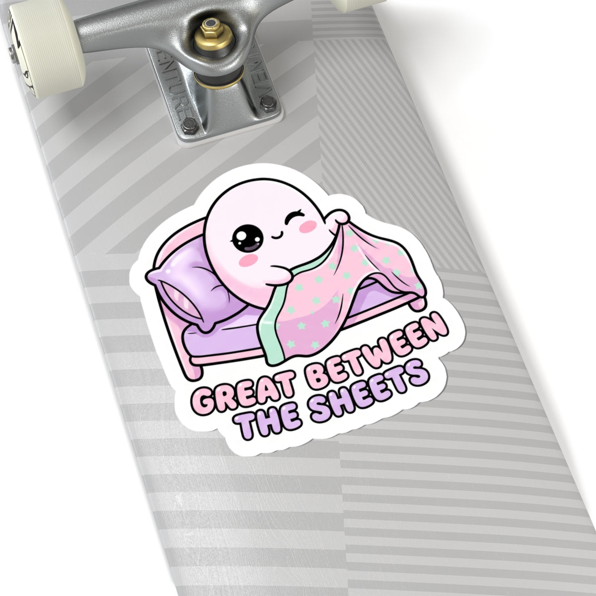 Round kiss-cut sticker featuring a bed ghost in mint star blanket, “GREAT BETWEEN THE SHEETS”