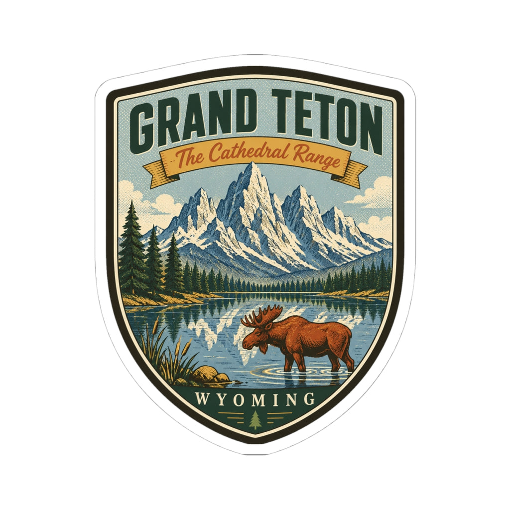 Shield travel sticker featuring moose, scenic mountains and lake, “Wyoming” text, white outline.