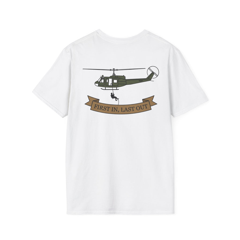 White T-shirt with green helicopter graphic and ribbon text “First In, Last Out”.