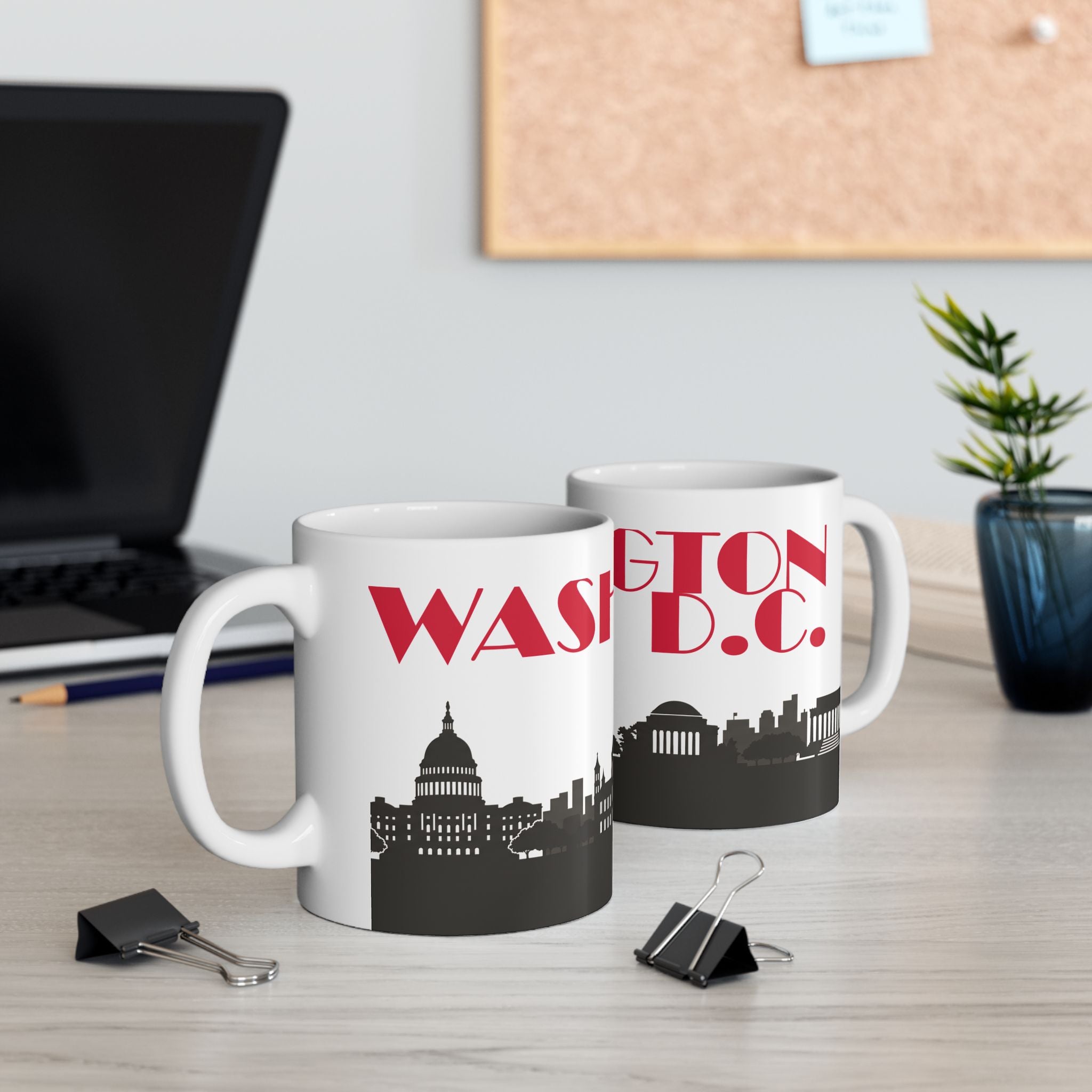 Set of two white ceramic mugs with red 'WASH' text and black D.C. skyline