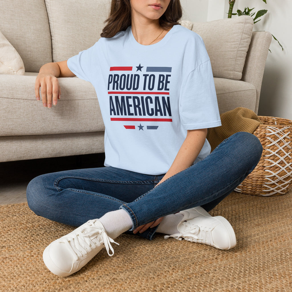 Light blue T-shirt with “PROUD TO BE AMERICAN” flag-style text graphic.