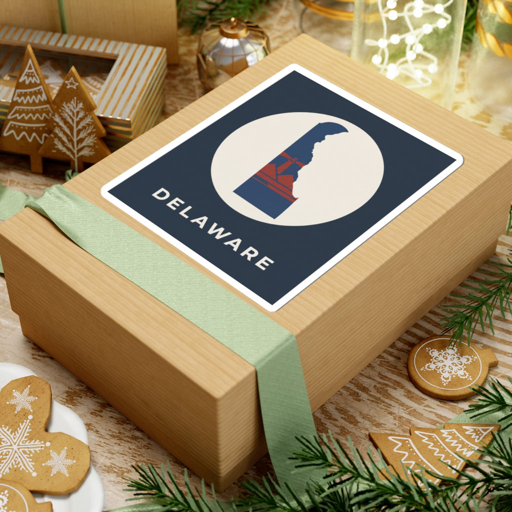 Kiss-cut Delaware silhouette sticker on a gift box, blue/red design in white circle with text