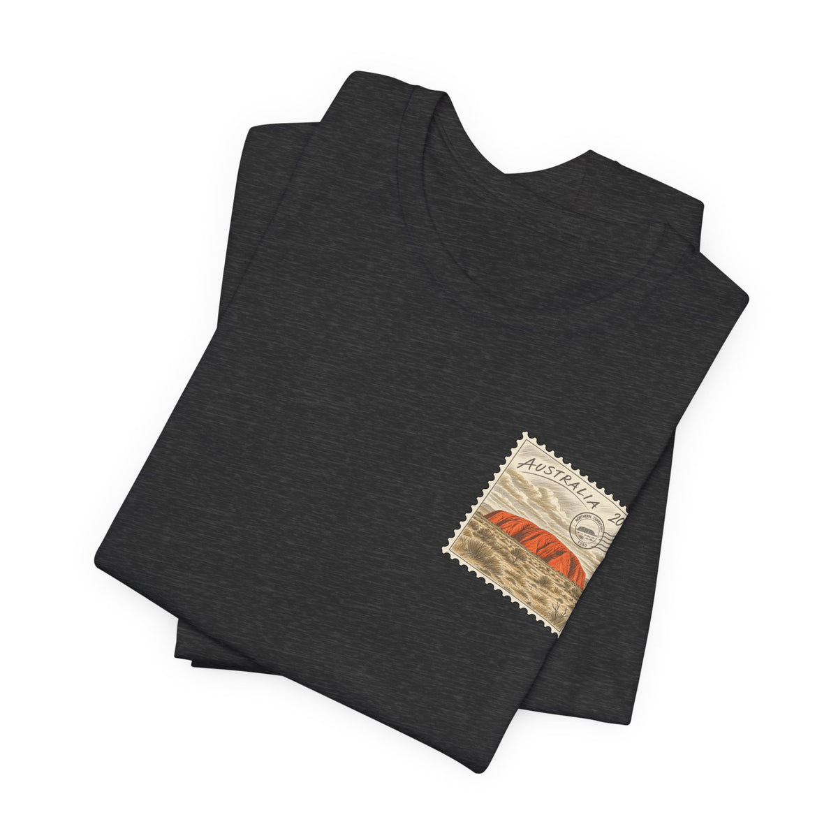 Black heather travel T-shirt, folded, with small Australia postage-stamp graphic on chest