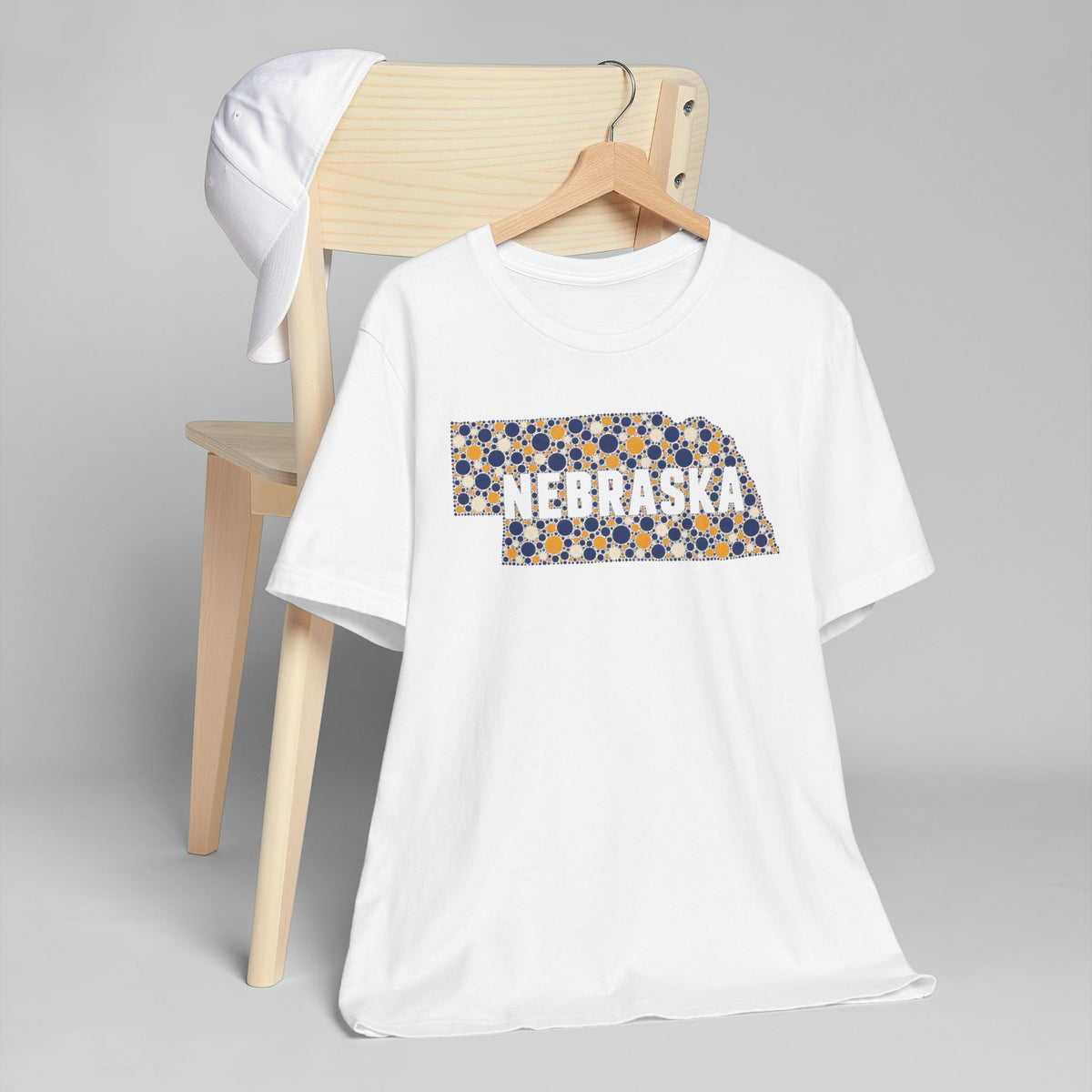 White Nebraska graphic T-shirt with colorful state outline logo on front