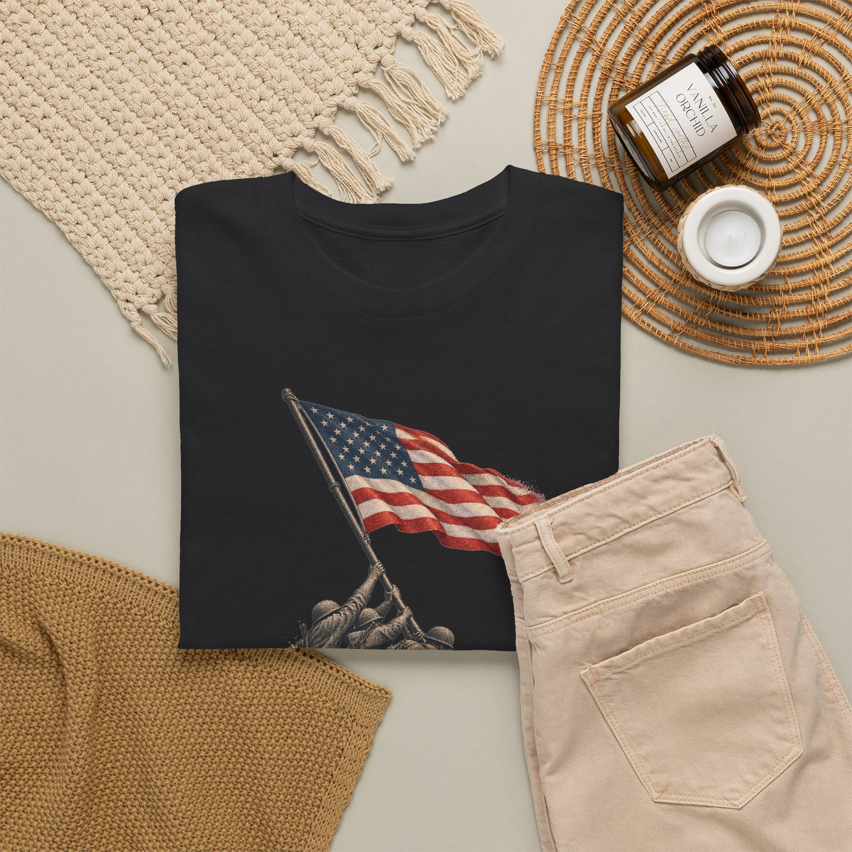 Black crewneck T-shirt with flag-raising graphic, front view