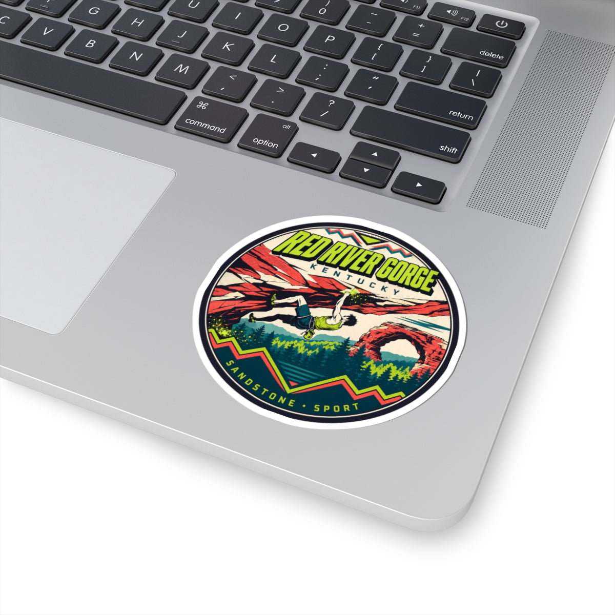 Round sticker on laptop: Red River Gorge Kentucky climber graphic, Sandstone Sport