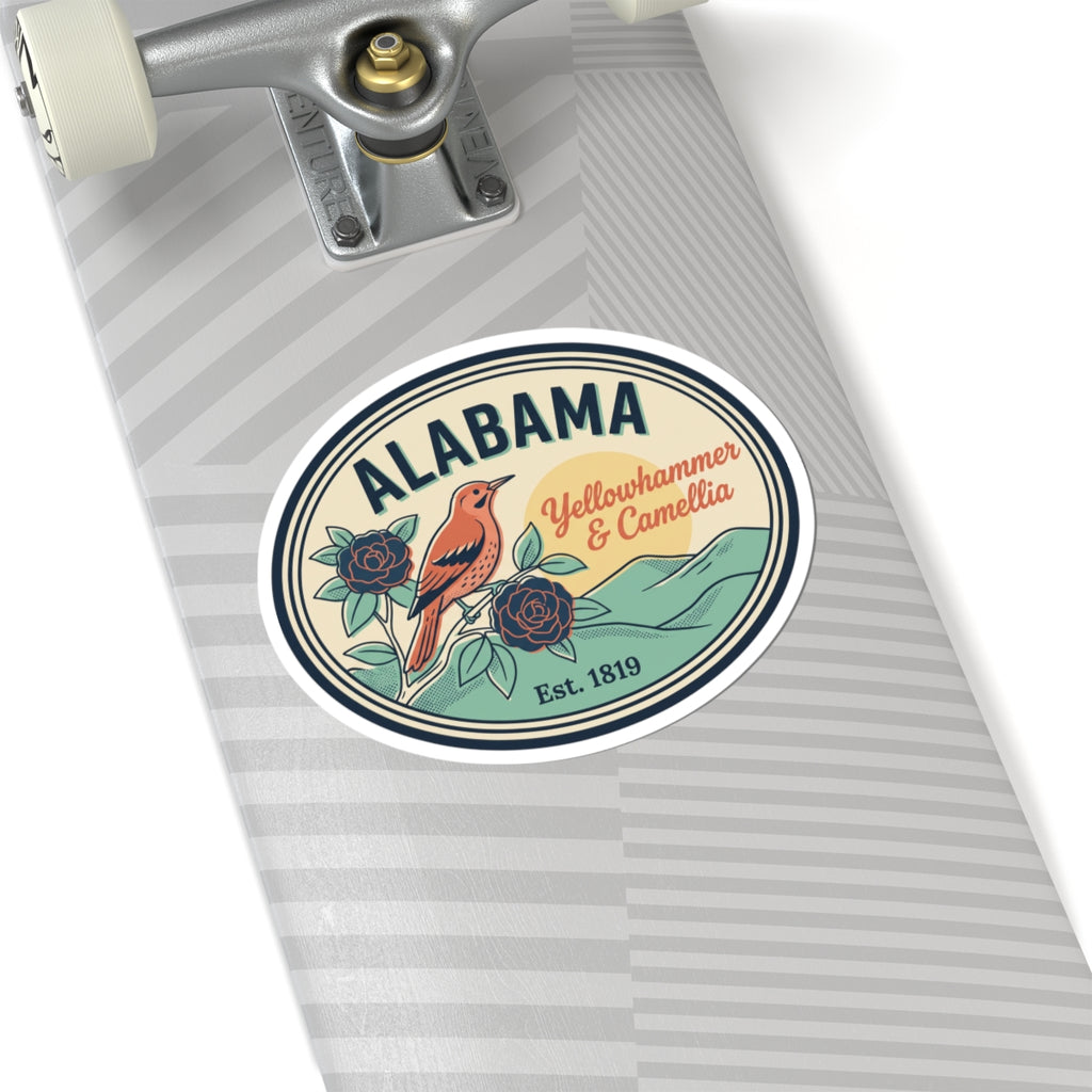 Alabama oval vinyl sticker on striped luggage tag, bird and camellia badge graphic