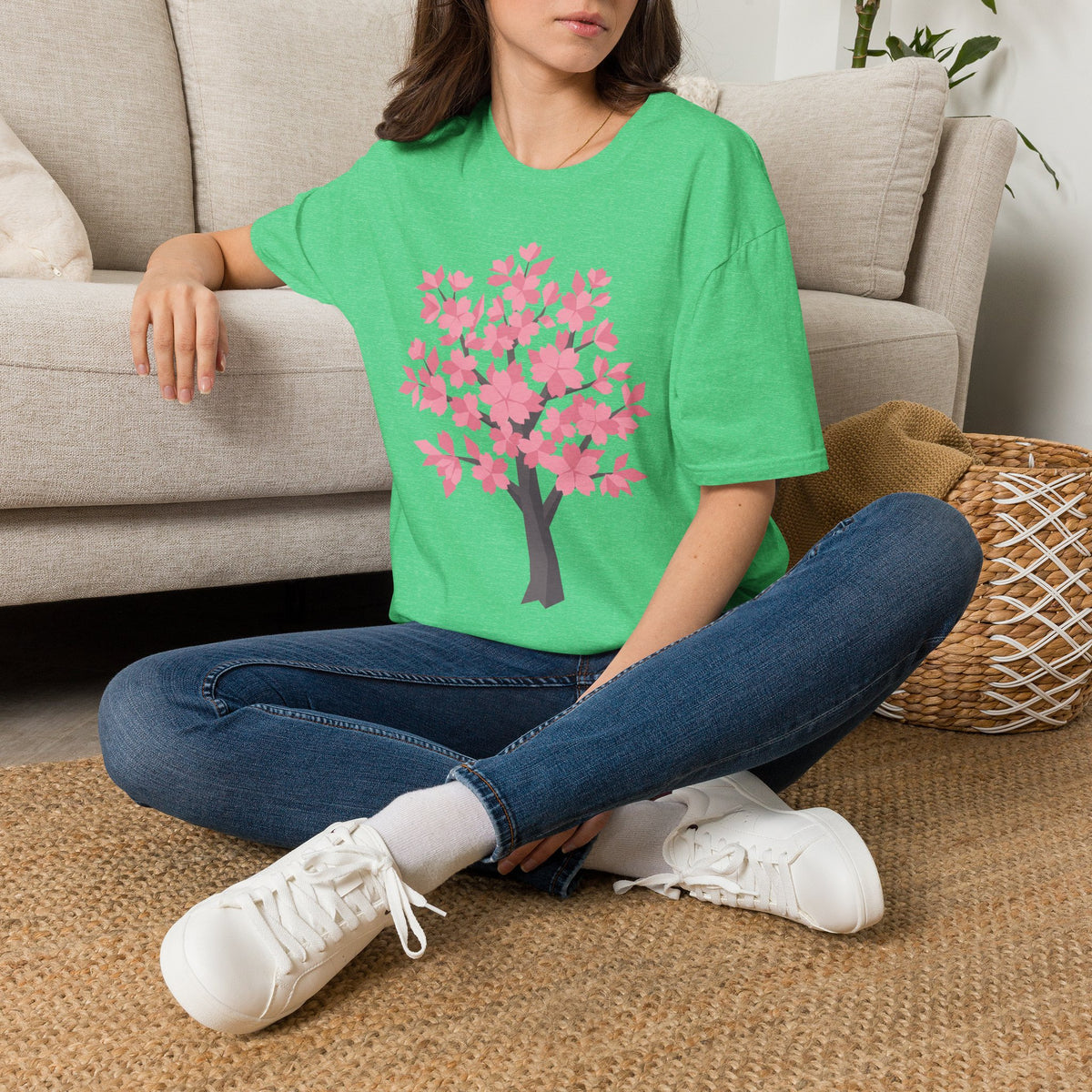 Unisex bright green T-shirt with pink cherry blossom tree graphic on the front