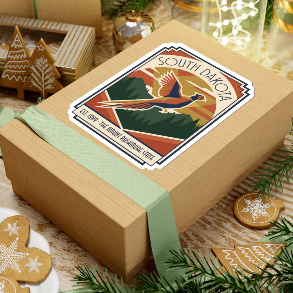 Die-cut vinyl sticker on a gift wrap featuring SOUTH DAKOTA pheasant in a retro border
