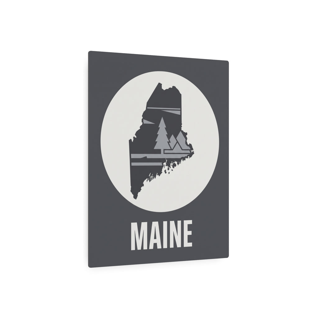 Maine metal art sign: dark gray square with white circle, pine tree silhouette, MAINE word
