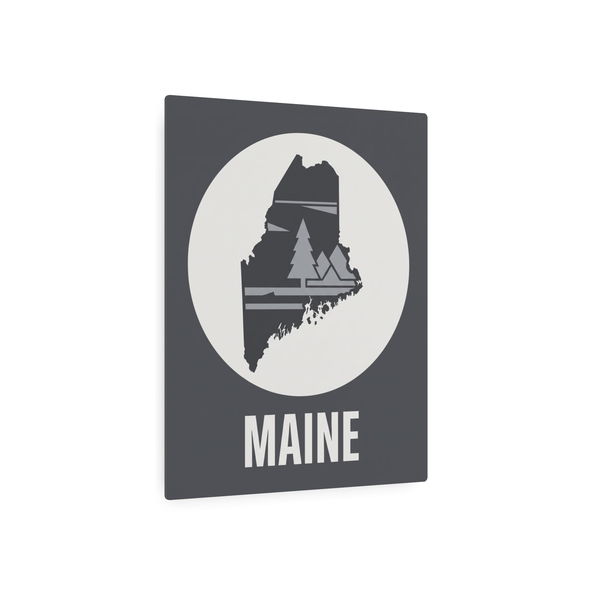 Maine metal art sign: dark gray square with white circle, pine tree silhouette, MAINE word