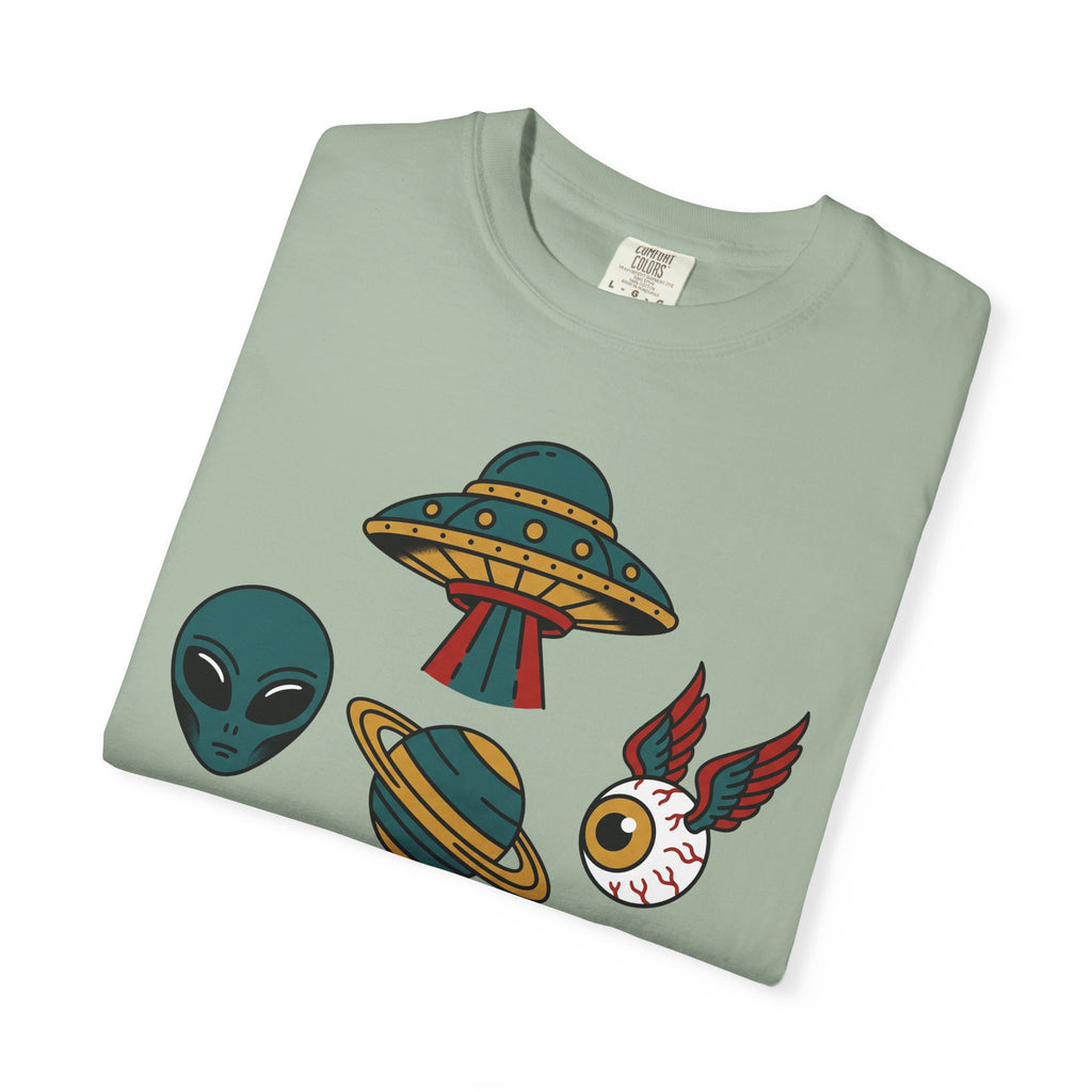 Light green T-shirt with alien, UFO, and red-winged cat graphic printed across front