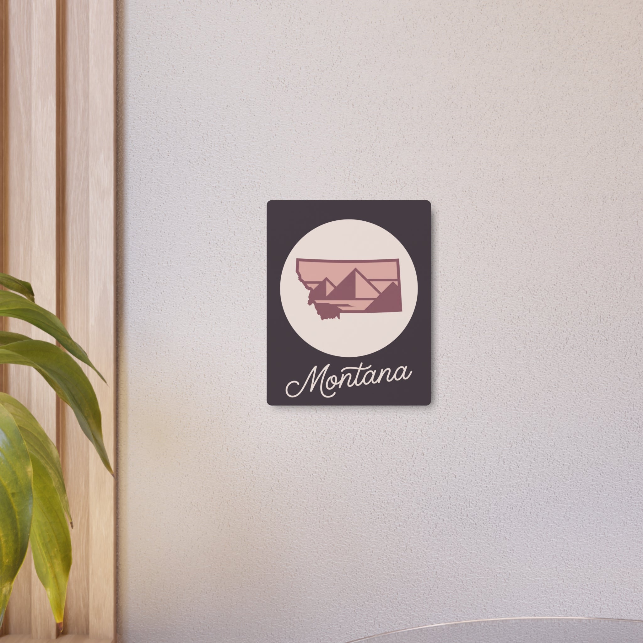 Mauve Montana silhouette metal wall art on dark square plaque, cursive script