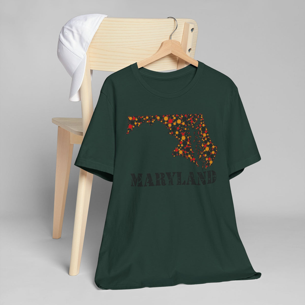 Dark green T-shirt with Maryland floral map graphic and text